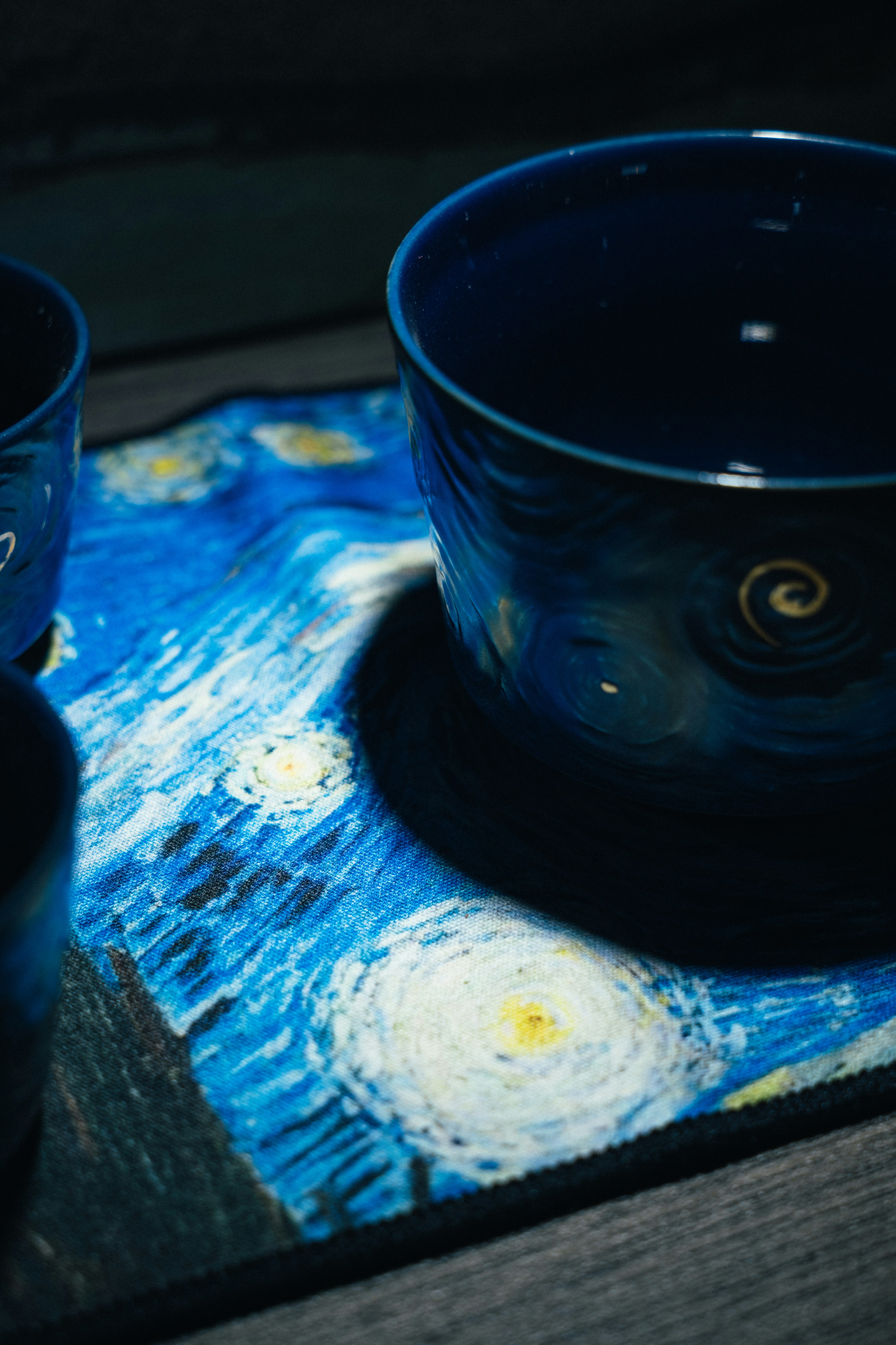Artistic custom ceramic cups displayed on a wooden table