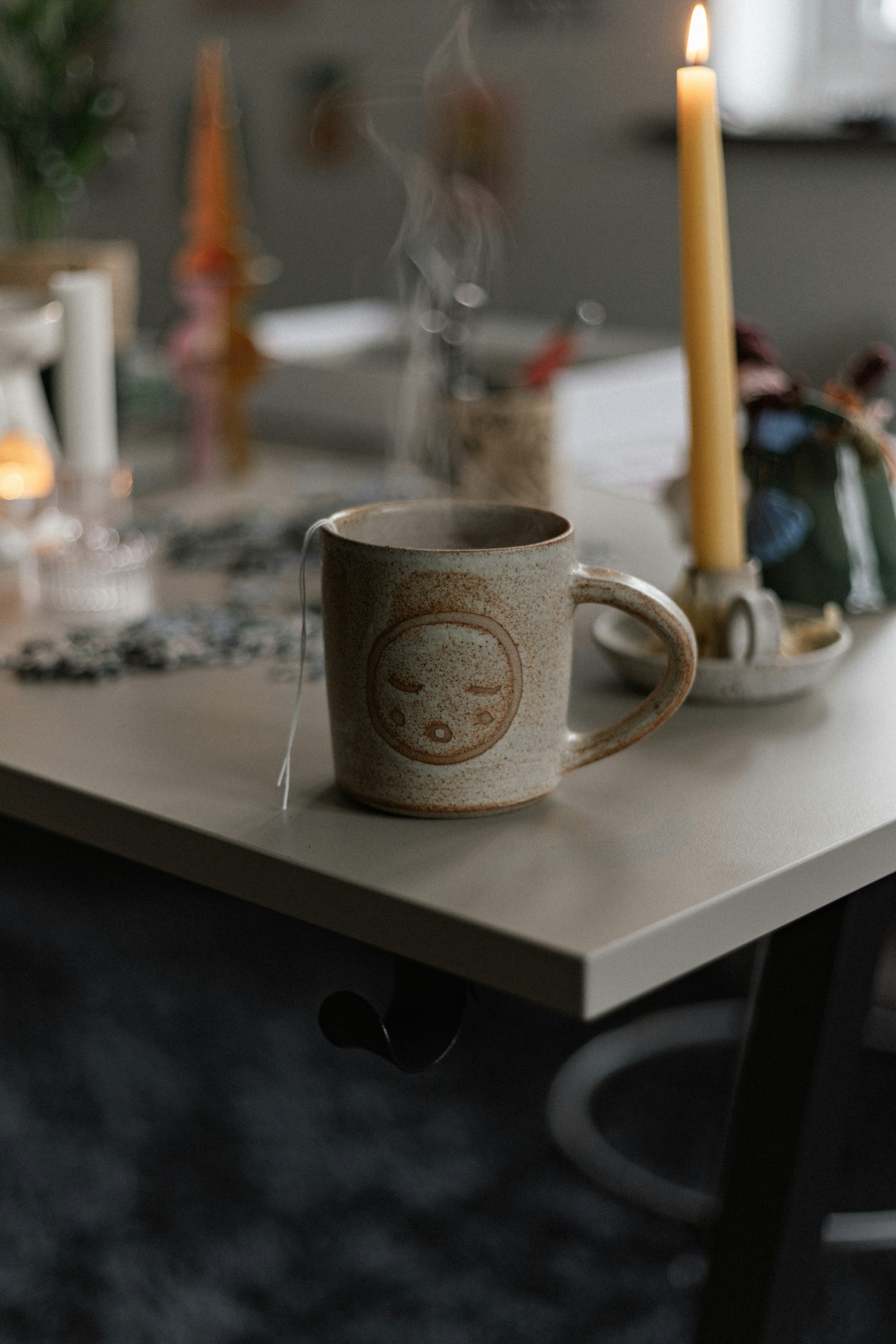 Desk featuring a custom ceramic cup with corporate logo and motivational quote.